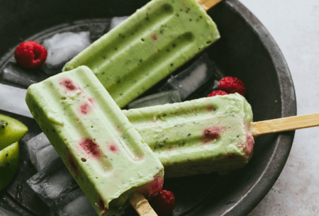 View Fruity fibre-filled ice lollies Three green fruity fibre-filled ice lollies on sticks