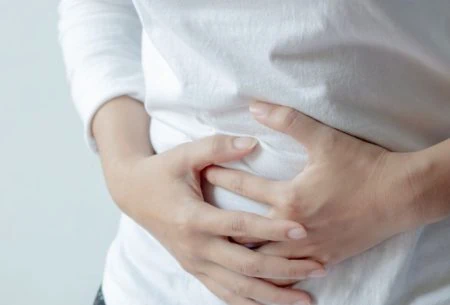 View Sucrase-Isomaltase Deficiency (SID) and Congenital SID An image of a woman holding her stomach
