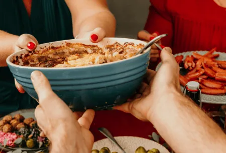 View Five top tips to prevent Christmas constipation Picture of people sharing food at Christmas.