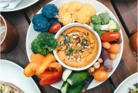 View Can eating more fibre help with managing diabetes? Platter of vegetables with a dip in the middle