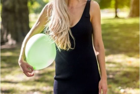 View Feeling bloated? Here’s what to do Megan Rossi holding green balloon outside
