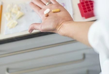 View 5 things that could ‘damage’ your gut A hand showing 3 different types of pills