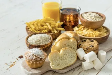 View When your gut becomes a brewery: A spotlight on auto-brewery syndrome An image of carbohydrate containing foods, including: bread, pasta, cookies, a muffin, and two sugary drinks