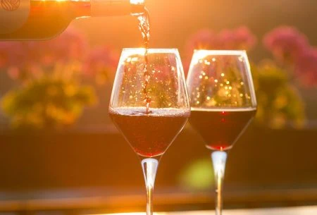 View Could drinking a little wine or gin have some benefits? Two glasses of red wine