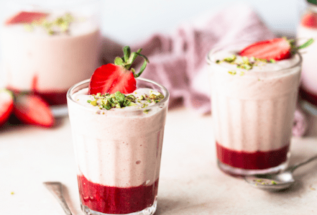 View Prebiotic strawberry mousse Three pots prebiotic strawberry mousse, topped with fresh strawberries