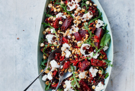 View Beetroot, lentil & goat’s cheese salad Colourful beetroot, lentil and goat’s cheese salad shown in a long serving dish with two serving spoons
